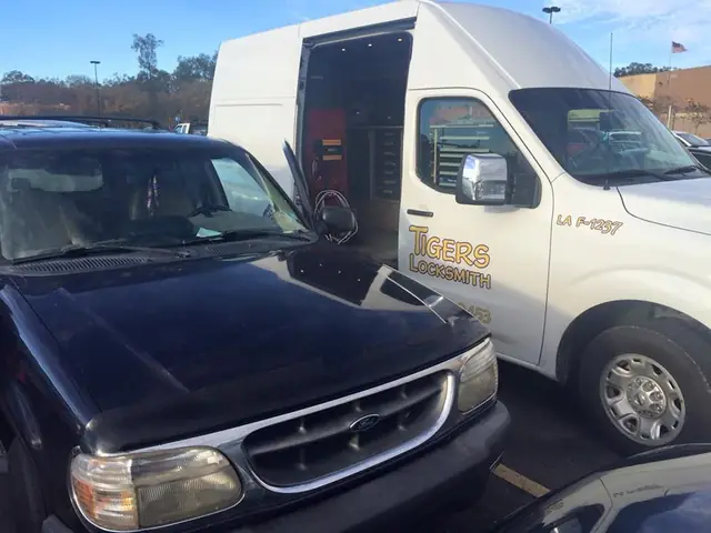 The open rear cargo area of a Tigers Locksmith van, showing organised key cutting and programming equipment
